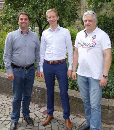 Lutz Bartl, Martin Werner and Harald Bohlinger after signing the merger